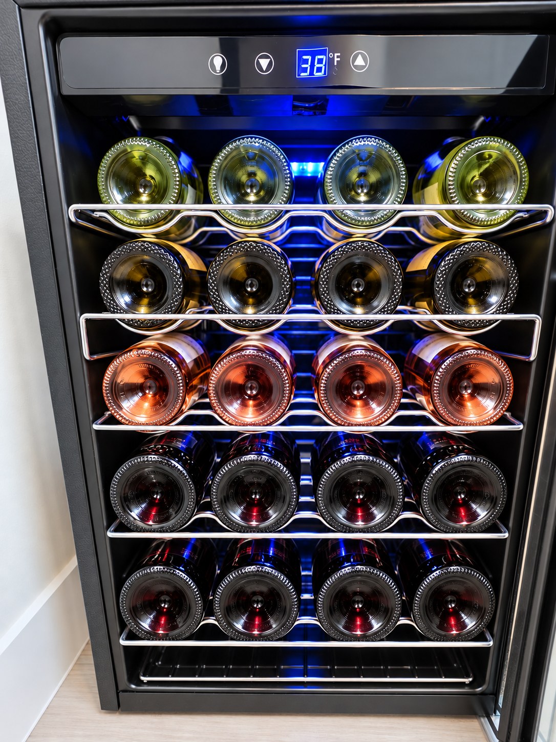 Wine cooler stocked with bottles of white, rosé and red wine