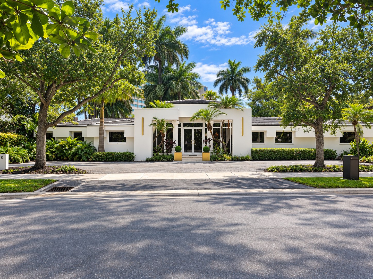 The Iliet Luxury Suites building seen from across the street on a sunny day